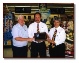 Rod Moffitt presenting Gananoque A&P staff with a plaque